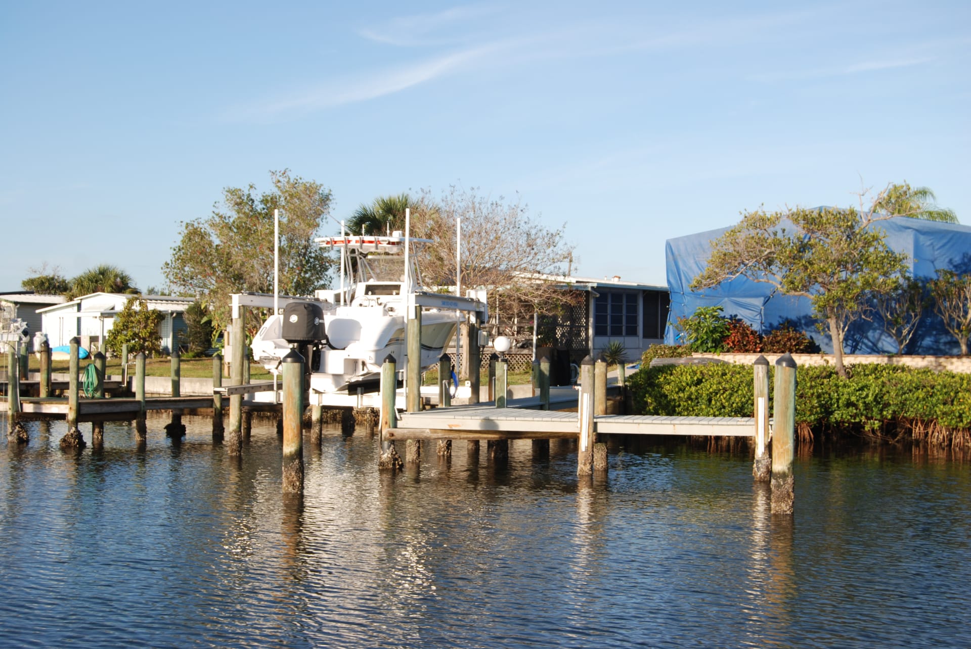 Boat on dock with dock steps, dock edging and dock box